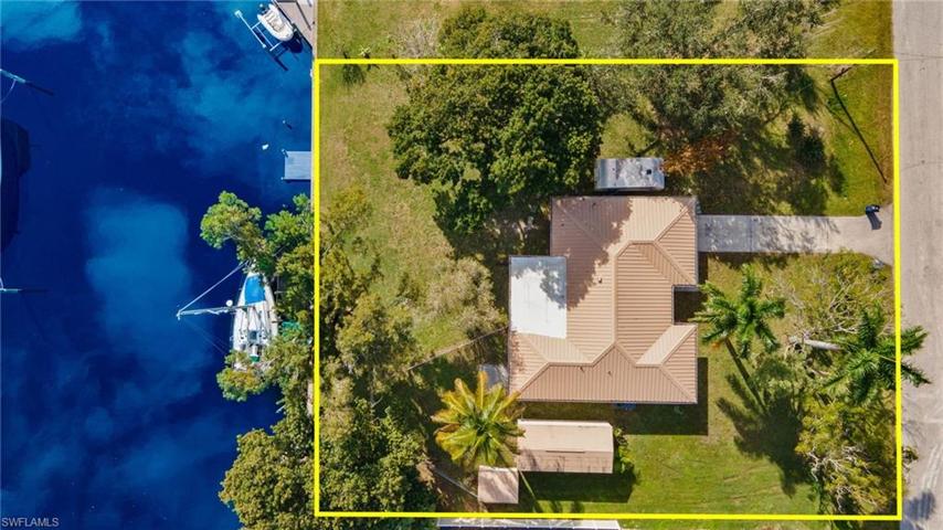 This double size lot offers plenty of room for a pool. There is a 280 sq ft shed with electricity that would be a perfect workshop!