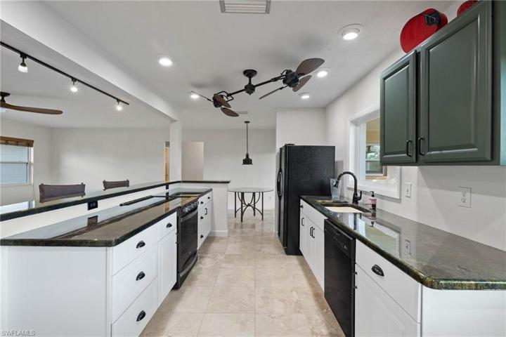 White lower cabinets and epoxy countertops.
