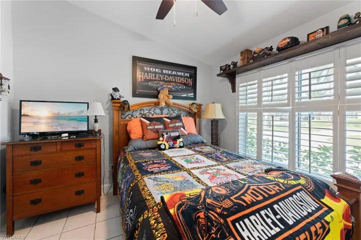 Third bedroom with ceiling fan, plantation shutters  and vaulted ceiling