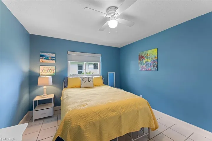 Guest Bedroom featuring tile floors and ceiling fan