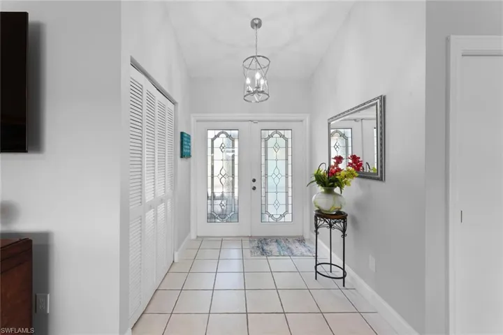 Entryway with an inviting chandelier