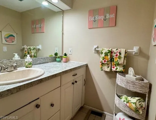 Bathroom with vanity and light tile patterned floors
