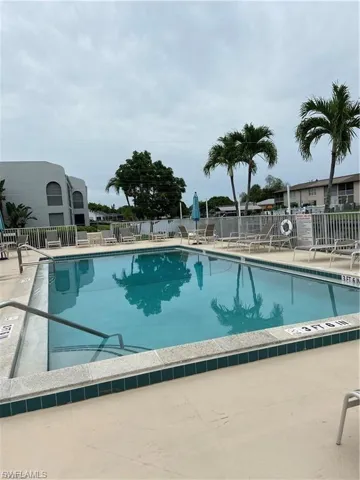 Community pool with a patio area