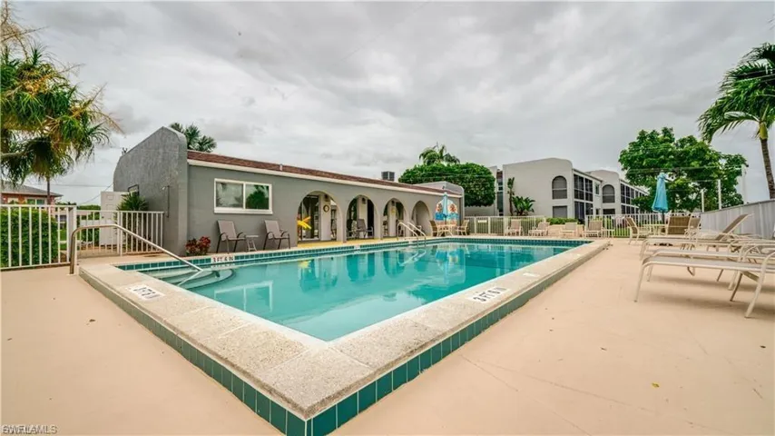 Community pool with a patio area