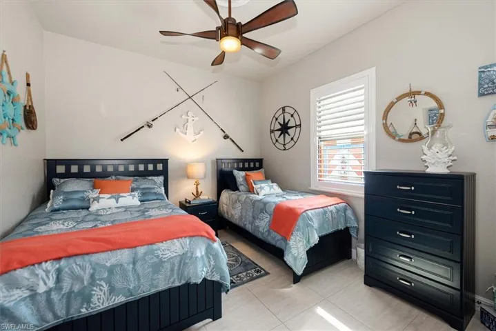 Bedroom featuring a ceiling fan and light tile patterned floors