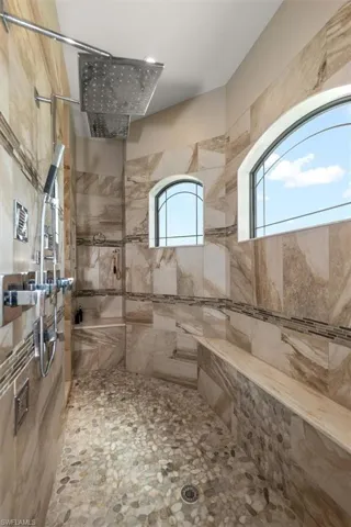 Full bathroom with tiled shower