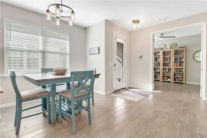Entry way, double doors to den, dining table