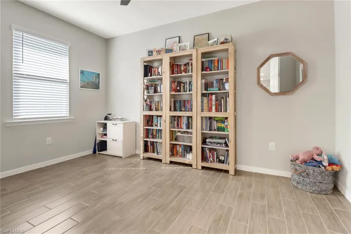 Misc room with a wealth of natural light tile flooring