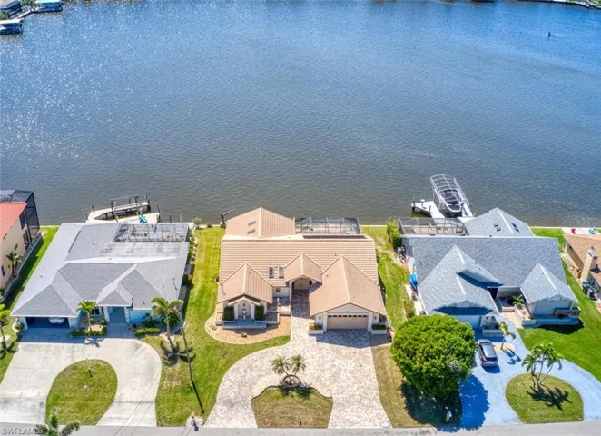 Aerial view featuring a residential view and a water view