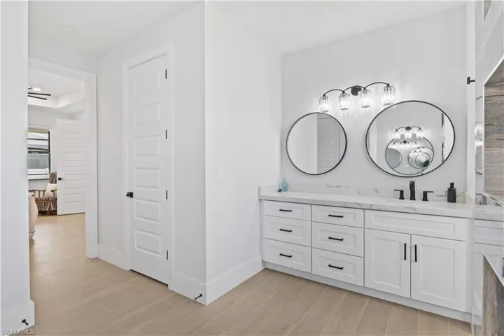 Bathroom with wood finished floors and vanity