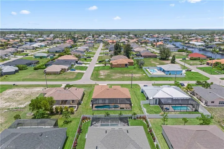 Aerial view of residential area with a nearby body of water