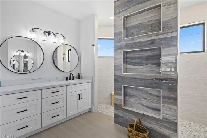 Bathroom with vanity and a walk in shower
