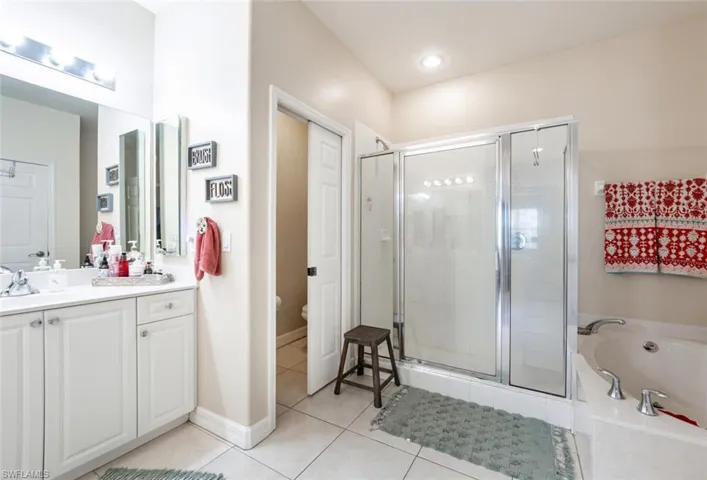 Master bathroom with separate tub and shower