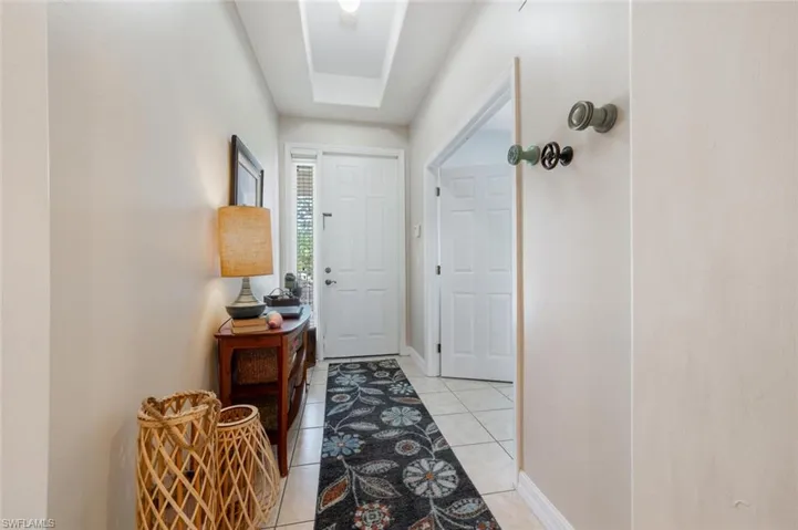 Front door with bedroom/den to the right