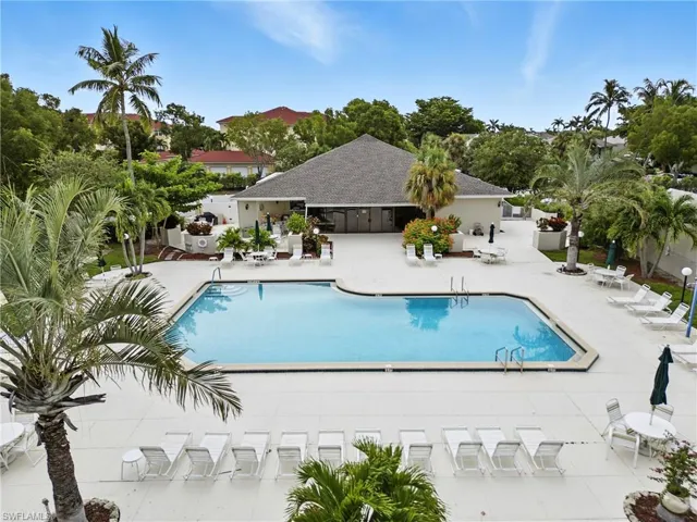 Community pool featuring a patio