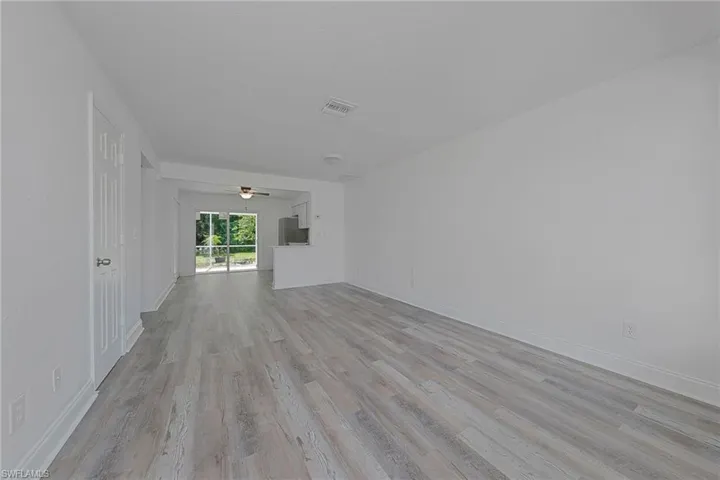 Unfurnished room with light wood-type flooring