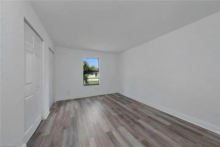 Spare room featuring hardwood / wood-style flooring