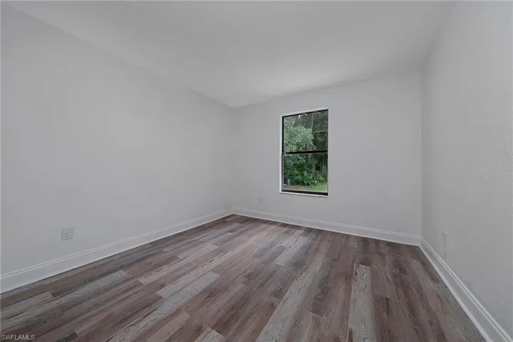 Spare room featuring hardwood / wood-style floors