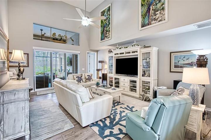 Living Room with Plantation Shutter View of Pool
