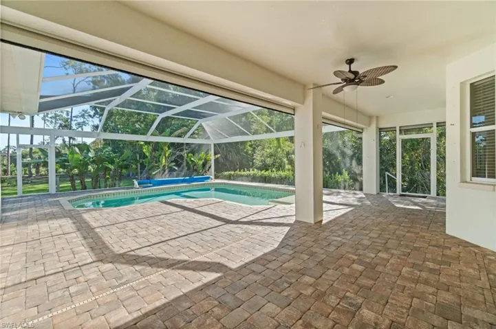 Screened-in Lanai with outdoor shower and Hurricane Impact Screens