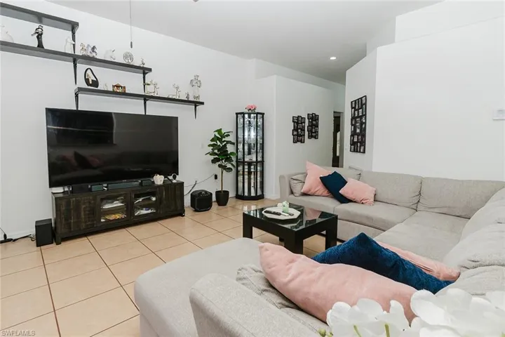 Living area with light tile patterned flooring