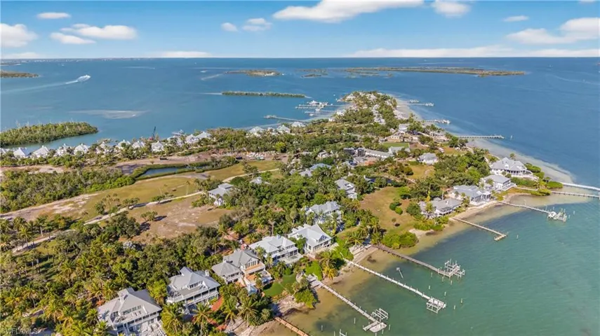 Aerial overview of property's location with a large body of water