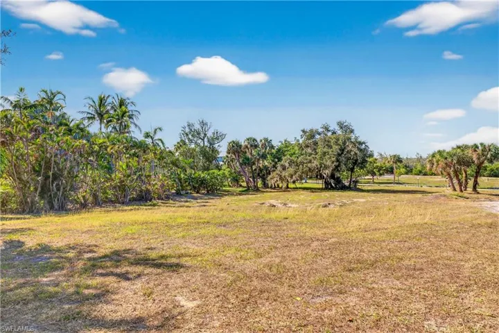 View of grassy yard with a rural view