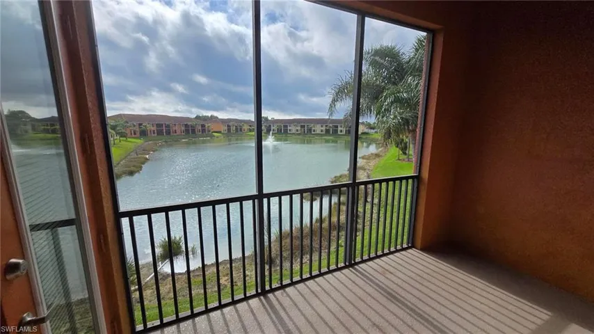 Unfurnished sunroom with a water view and plenty of natural light