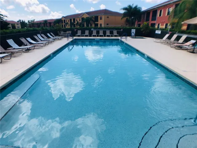 View of swimming pool with a patio area