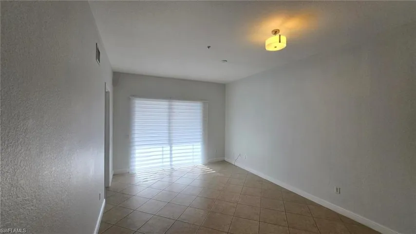 View of tiled spare room
