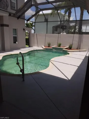 View of pool featuring a lanai and a patio