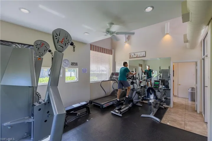 Gym with ceiling fan and a wealth of natural light