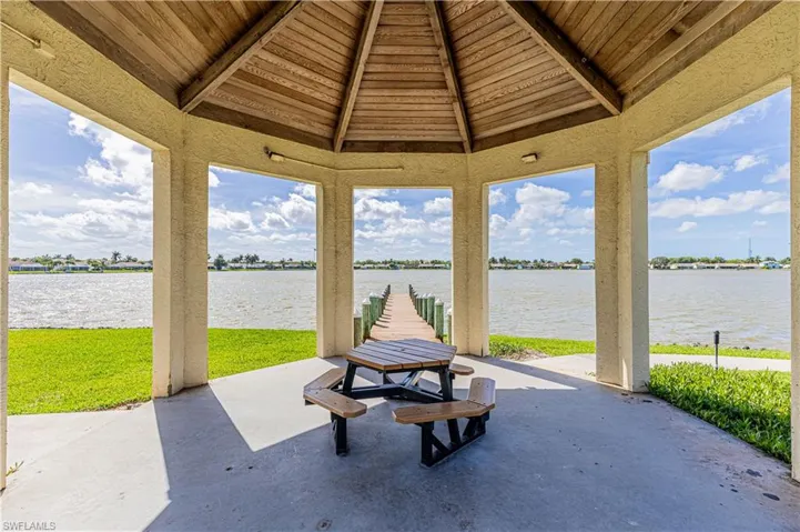 View of patio / terrace with a water view and a gazebo