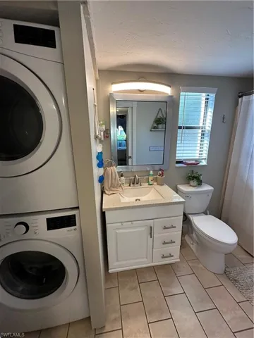 Master Bath with stacked private laundry
