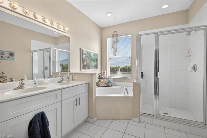 Dual vanity with undermount sinks and white shaker-style cabinetry