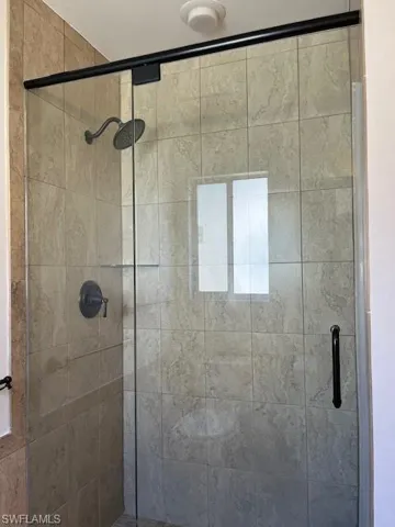 Bathroom featuring a shower with shower door