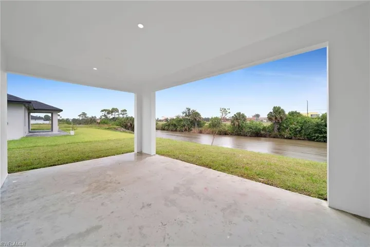 View of patio with a water view