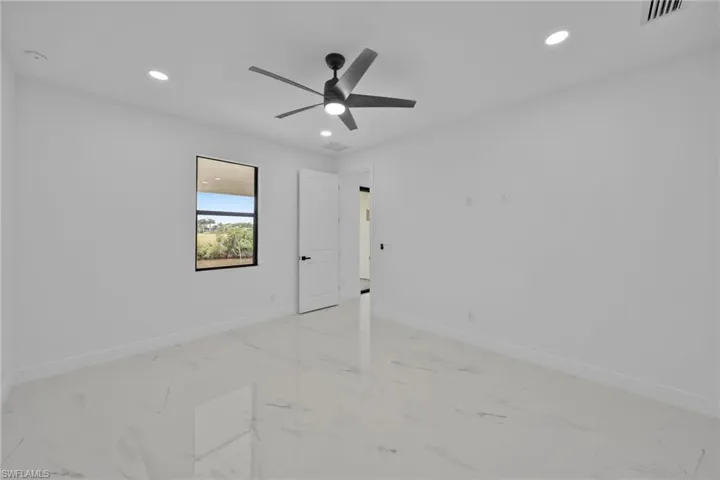 Unfurnished room with ceiling fan