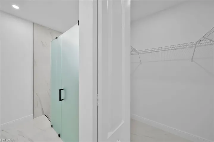 Bathroom with a shower with shower door