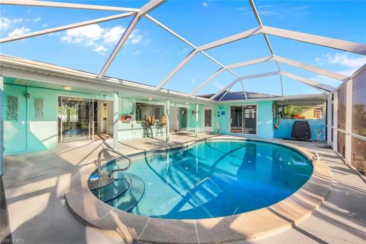 Outdoor pool with a patio and a lanai