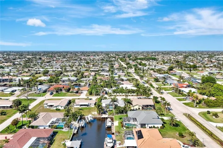 Drone / aerial view with a residential view and a water view