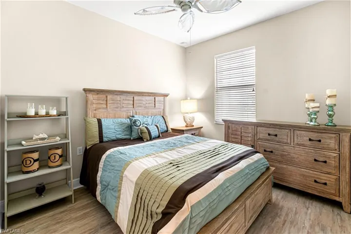 GREAT SIZED GUEST BEDROOM WITH LUX VINYL PLANK MATCHING PRIMARY BEDROOM.