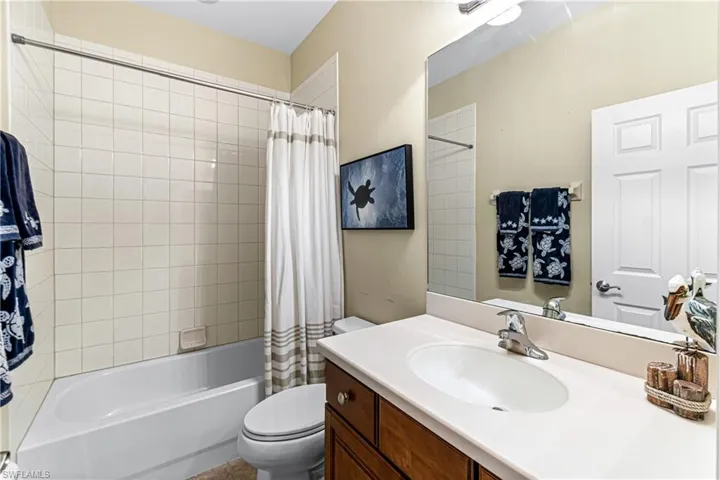 GUEST BATH WITH SAME CABINETS AS KITCHEN AND PRIMARY BATH GIVES HOME CHIC AND ORGANIZED FEEL.