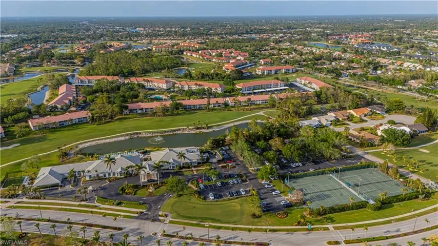 Bird's eye view featuring a water view, view of golf course, and a residential view