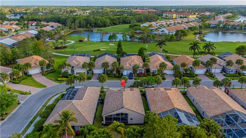 Birds eye view of property with a water view, view of golf course, and a residential view