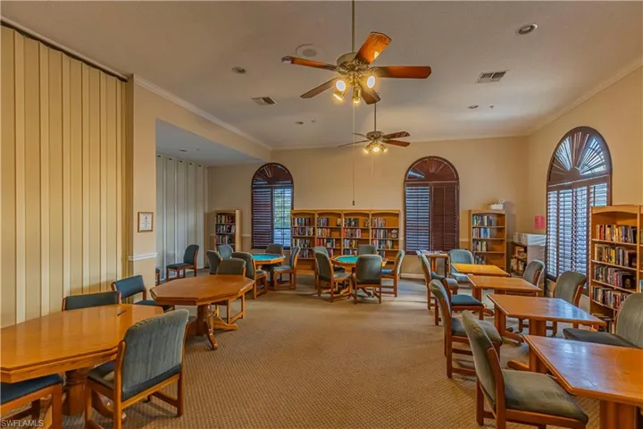 Dining area featuring visible vents, crown molding, carpet flooring, and a healthy amount of sunlight