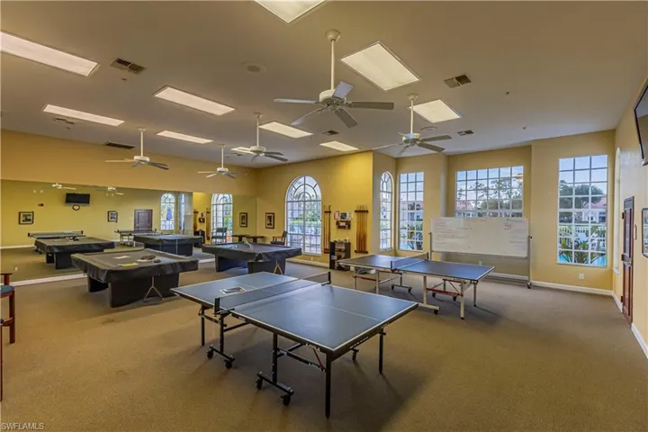 Rec room featuring visible vents, billiards, carpet floors, and a ceiling fan