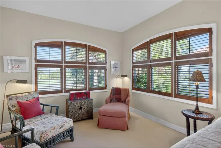 Sitting room with baseboards and carpet