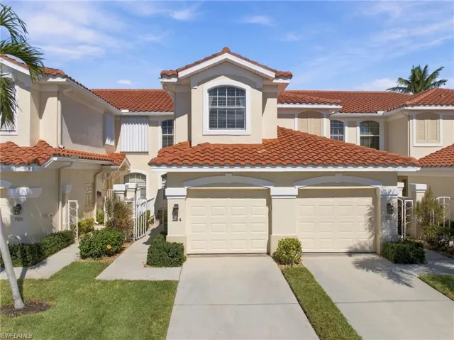 Out front, a private one-car garage is paired with an extended driveway, giving you extra space for guests or a second vehicle.