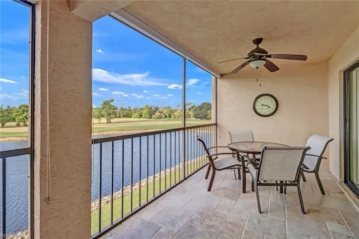 Patio with a water view and ceiling fan